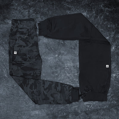 Women's Reset Joggers combo shot — Black and Black Camo luxury nylon/elastane joggers by VNDK8